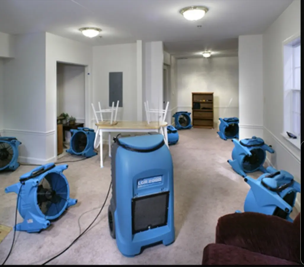 Air movers and dehumidifier setup for Water Damage Restoration in Central City